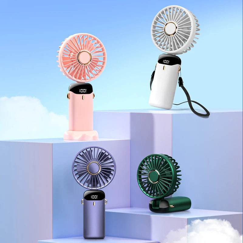 “USB Handheld Mini Fan – Foldable, Portable & 5-Speed Cooling with Phone Stand!”